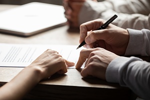 an employee signing a contract