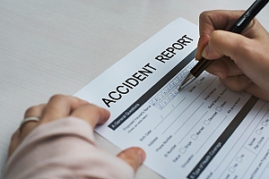 Injured worker fills out accident report