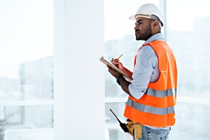 construction worker reviewing contract