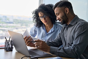 man and women reading an insurance dispute document