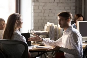 two people arguing in office