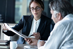 women lawyer discussing mechanic liens dispute with client