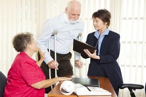 older couple with lawyer after a motorcycle accident