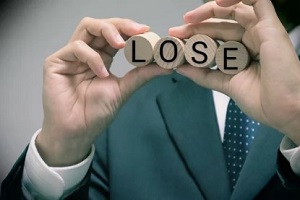 man holding lose word in wooden blocks