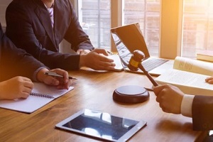 lawyer judge and client in a room