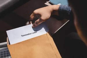 employee opening a termination letter