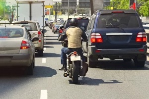 motorcycle rider in traffic