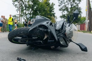 CA motorcycle lies on the sidewalk after a road trip. Severe accident
